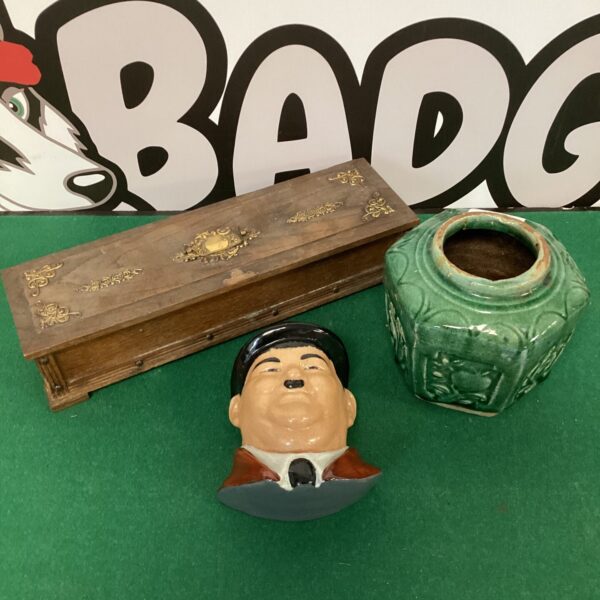 Vintage Oliver Hardy bust with antique pot and wooden box.