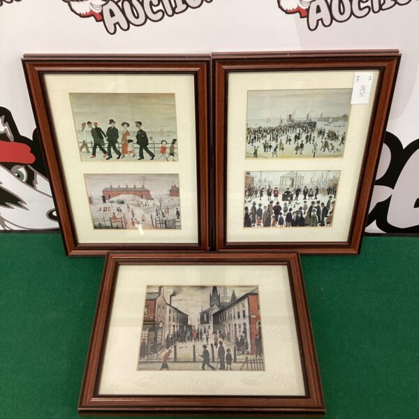 Set of three framed LS Lowry style prints depicting industrial scenes.