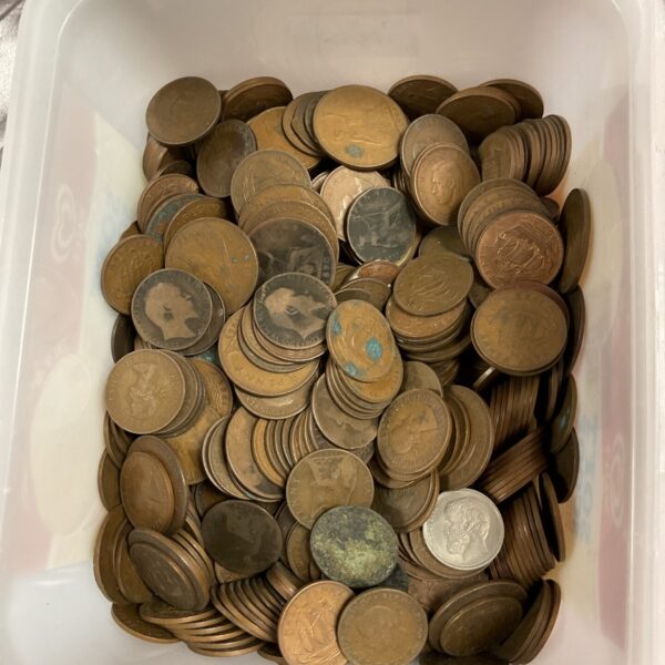 A tub filled with vintage British pennies and halfpennys for collectors.