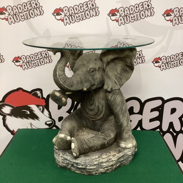 Vintage Crosa elephant wine table with glass top.
