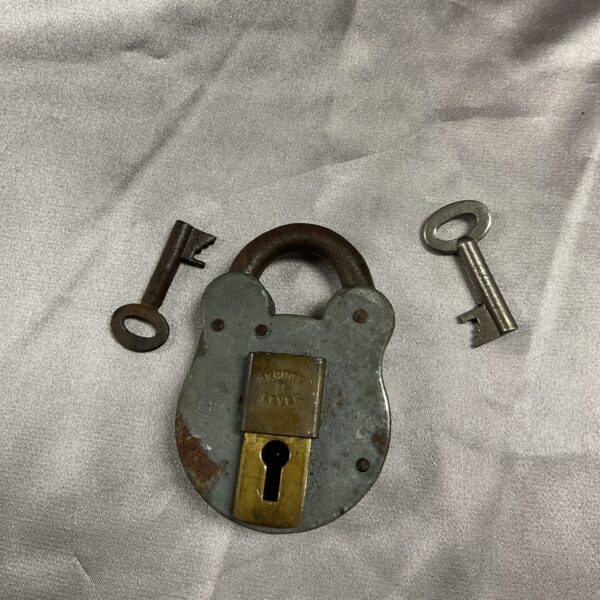 Vintage two lever padlock with original keys, antique security.
