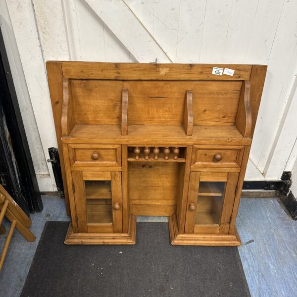Vintage pine display rack with cupboard doors and display shelves.