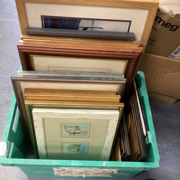 Mixed lot of vintage picture frames and artwork for wall decor.