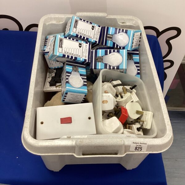 Mixed electrical lot with various light bulbs and components.