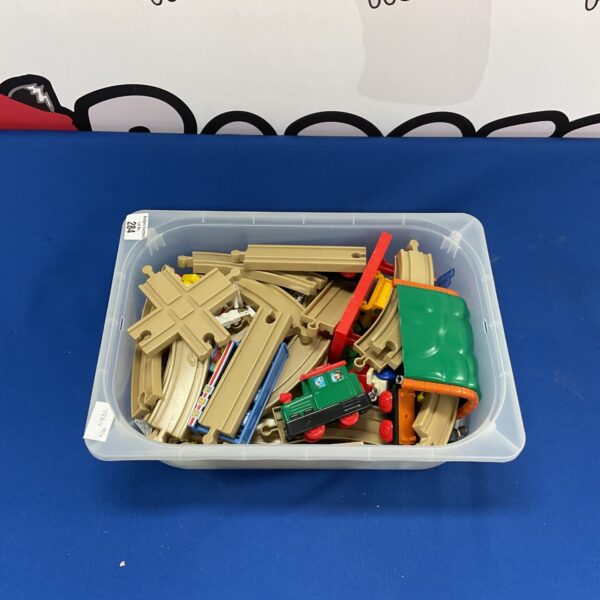 Vintage car rail track set with wooden and plastic pieces.