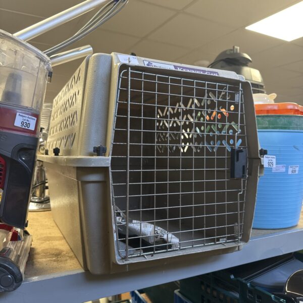 Used pet transit box with wire mesh front for small animals.