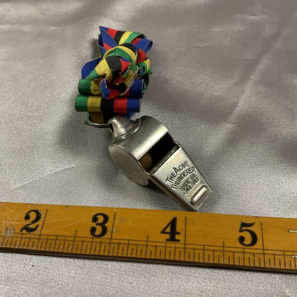 Vintage Acme Thunderer metal whistle with lanyard.