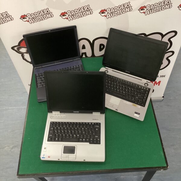 Vintage laptops lot including Sony Vaio and Toshiba Satellite models.