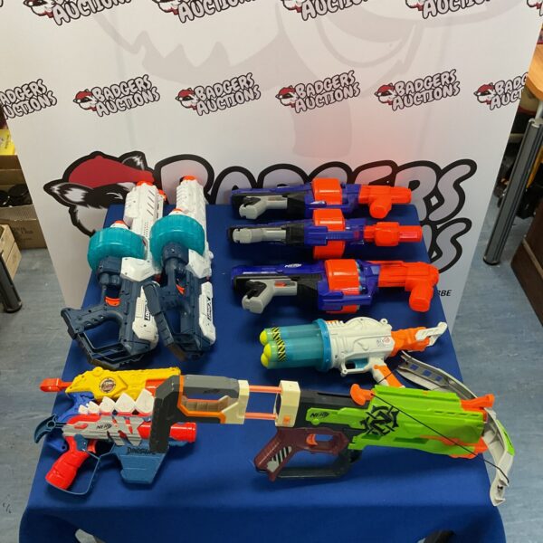 Assortment of Nerf guns and foam dart blasters for kids.