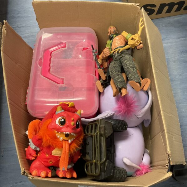Mixed toy lot featuring vintage Action Man figure and plush toy.