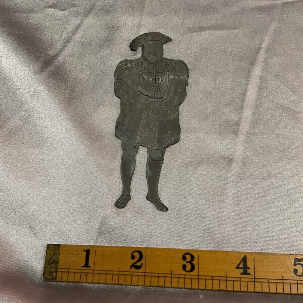 Silver Henry VIII bookmark, detailed Tudor king collectible.