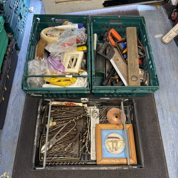 Assorted hand tools and hardware from a shed clearance lot.