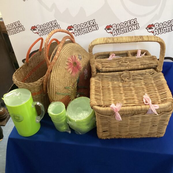 Vintage wicker picnic basket with contents for summer picnics.
