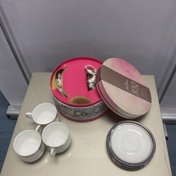 Vintage Royal Albert cups and saucers with floral pattern.