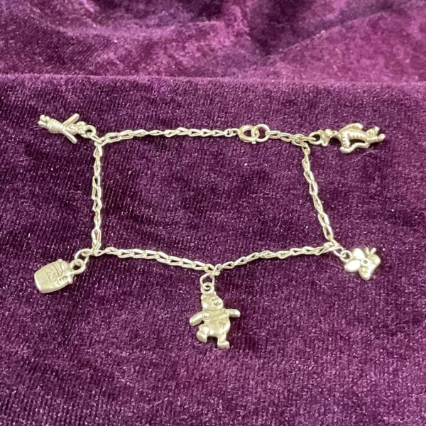 Silver Winnie the Pooh bracelet with Tigger and Piglet charms.