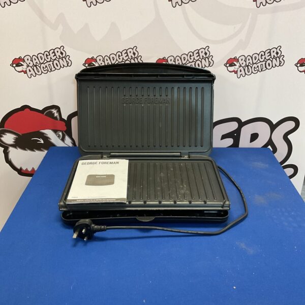 Used George Foreman grill, showing wear and tear.