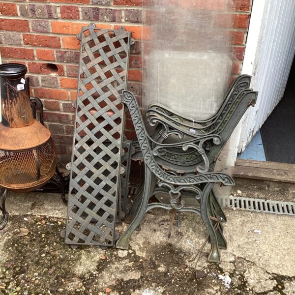 Vintage wrought iron garden bench kits showing intricate detailing.