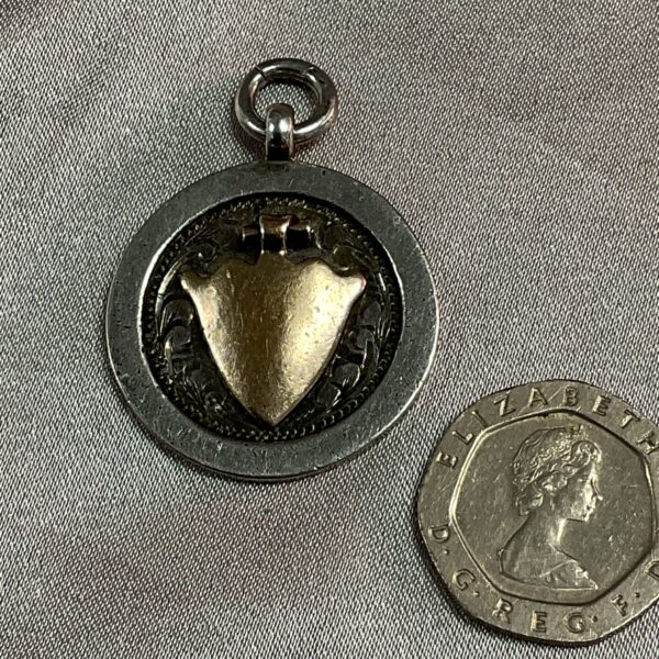 Vintage 1927 Stokenchurch Gymkhana medal with horse detail.