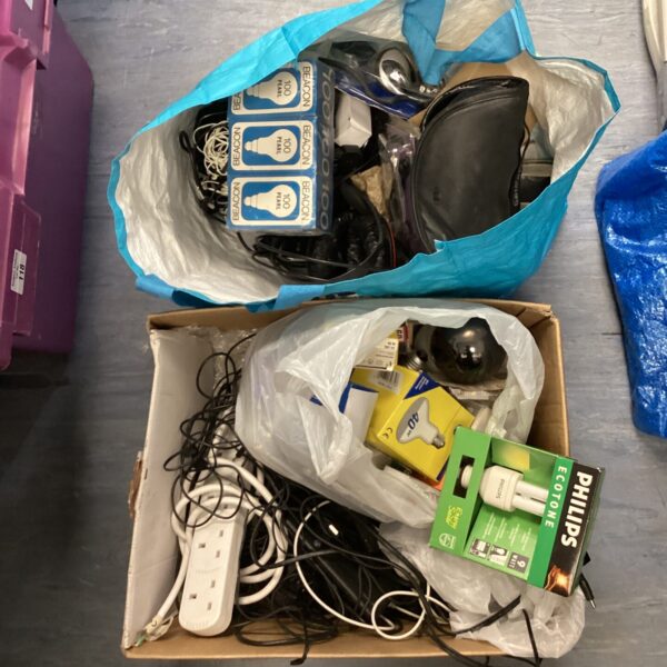Mixed lot of electrical cables and lightbulbs for DIY projects.