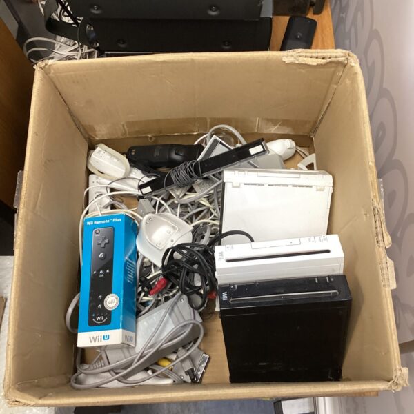 Nintendo Wii console lot with remotes and accessories.