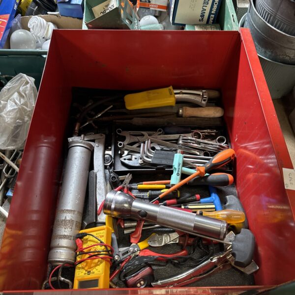 Metal tray filled with assorted hand tools for workshop or DIY.