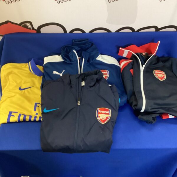 Lot of three vintage Arsenal football shirts for collectors.