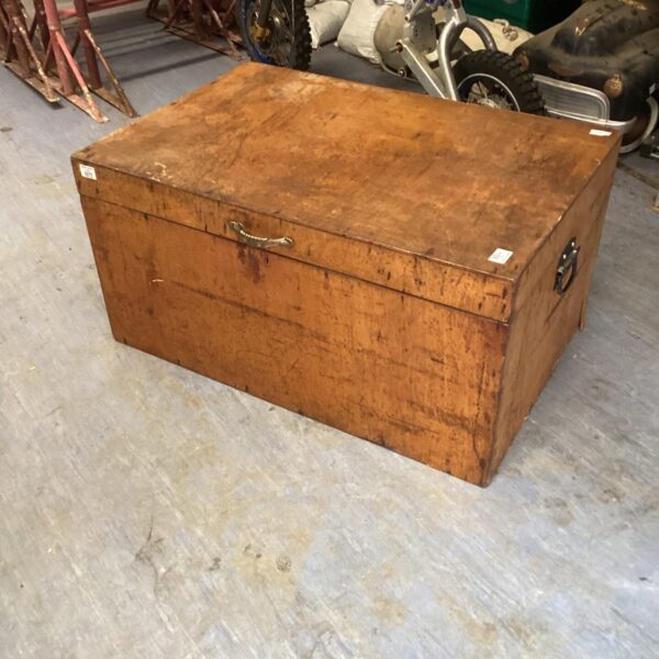 Large vintage wooden trunk with a weathered exterior.