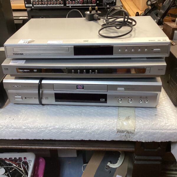 Lot of three vintage DVD players from Toshiba, Bush, and Hitachi.