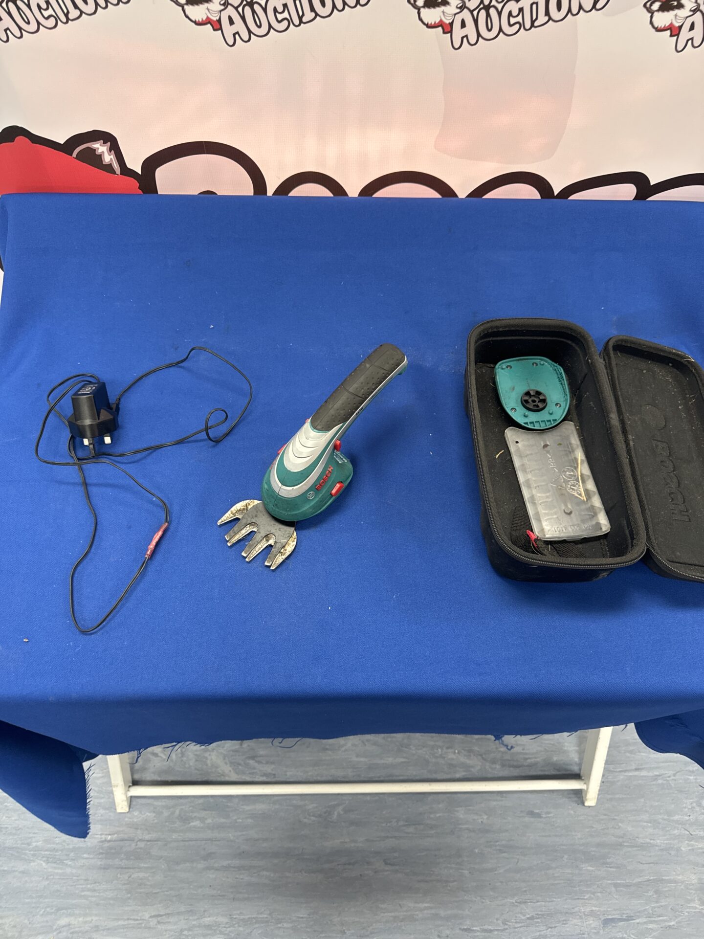 857 Bosch isio handy garden pruner with charger – working, charger cable repaired & sealed
