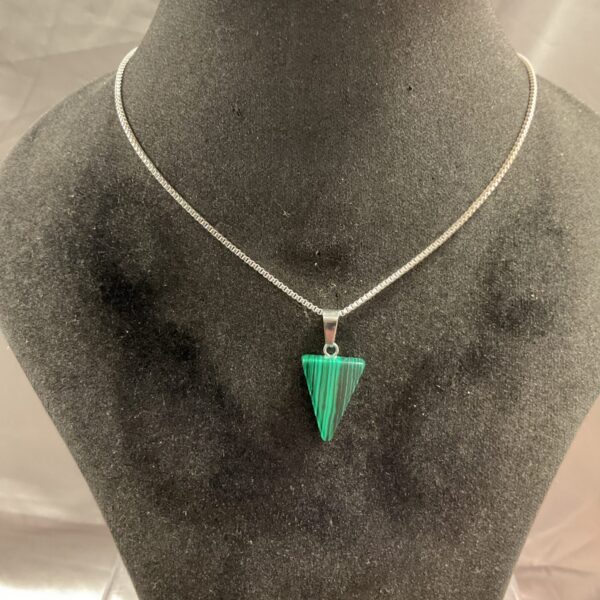 Silver chain necklace with a triangular malachite pendant.