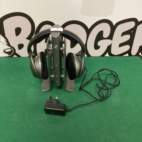 Sennheiser wireless headphones on charging station, used condition.