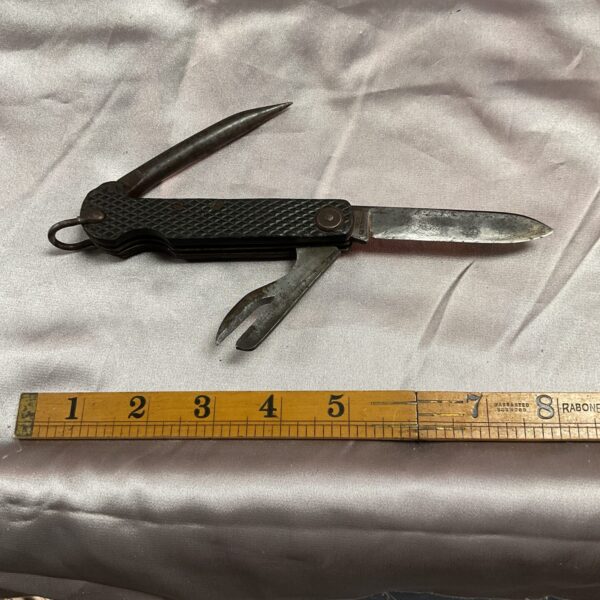 Vintage Boy Scout pocket knife with multiple blades.