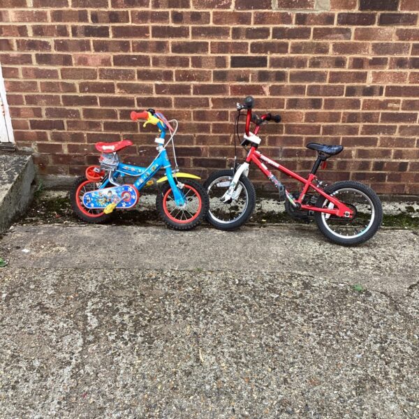 Red and blue childrens bikes for sale.
