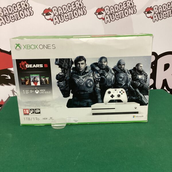 Microsoft Xbox One S 1TB gaming console with game packaging.