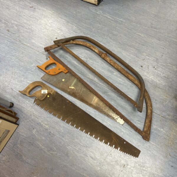 Lot of four vintage wood hand saws for woodworking.