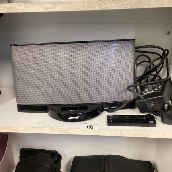 Black Bose iPod docking station with remote control.