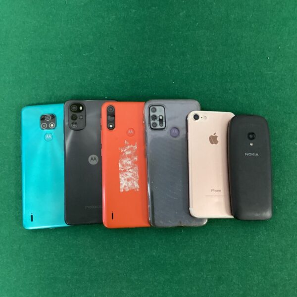 Blue Motorola smartphone in a lot of used mobile phones.
