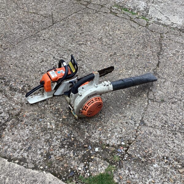 Stihl chainsaw leaf blower combination tool for garden maintenance.
