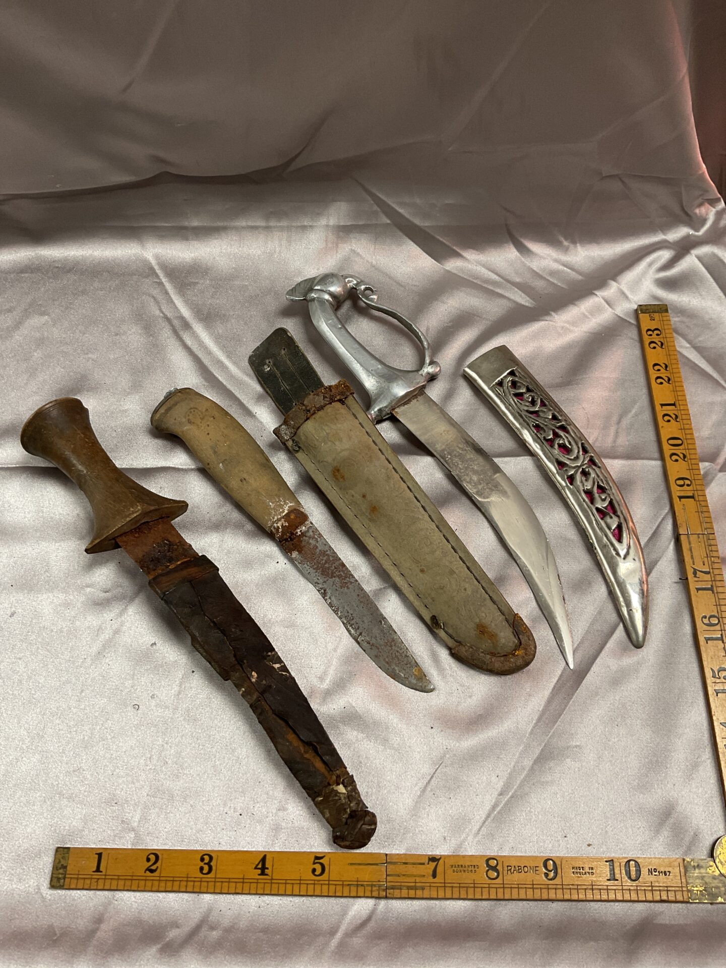 775 Three vintage eastern daggers
