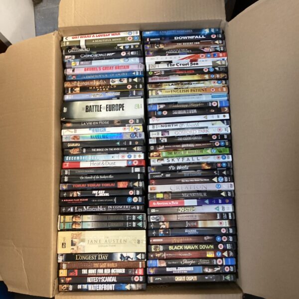 Large collection of assorted DVDs for home entertainment and film enthusiasts.
