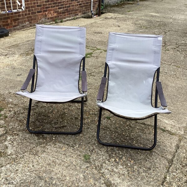 Two vintage folding garden chairs with canvas seats.