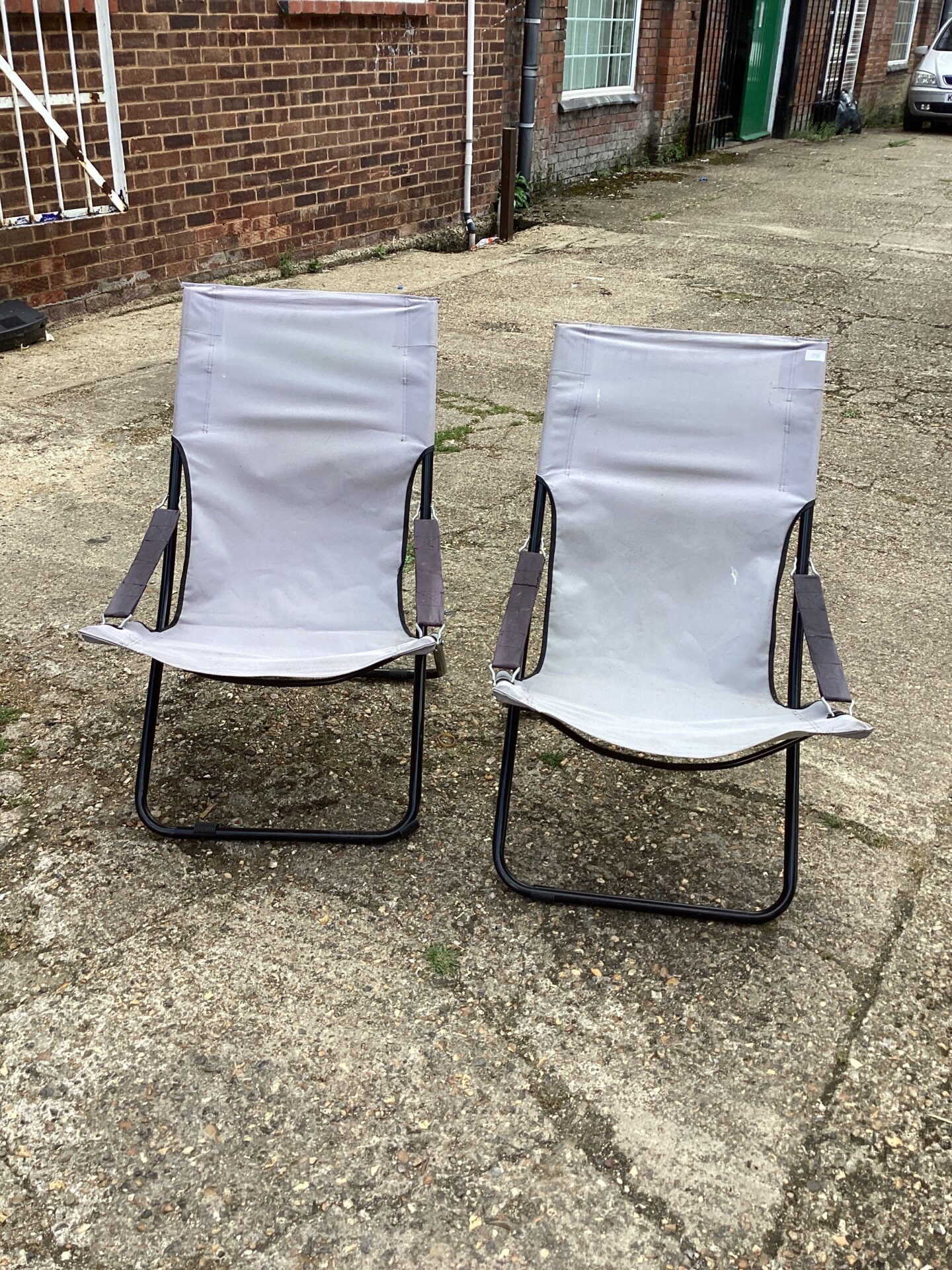 1053 Two canvass folding garden chairs