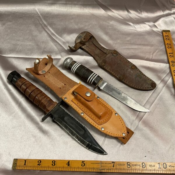Vintage lot of two sheath knives with leather sheaths.