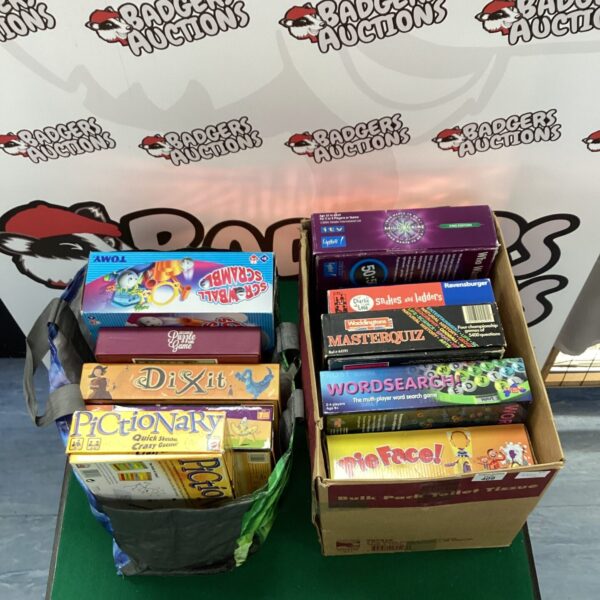 Assorted board games lot including Snakes and Ladders and Pictionary.