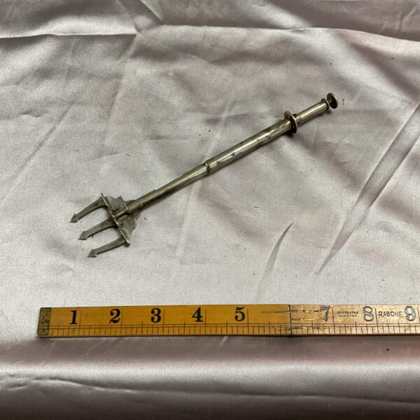 Antique Edwardian silver plated telescopic pickle fork for serving.