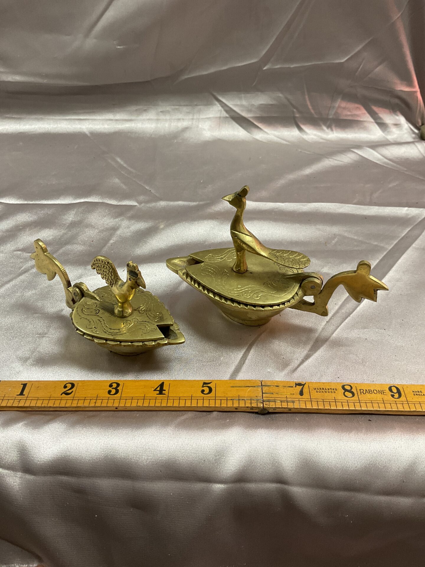 786 Two Indian brass oil lamps