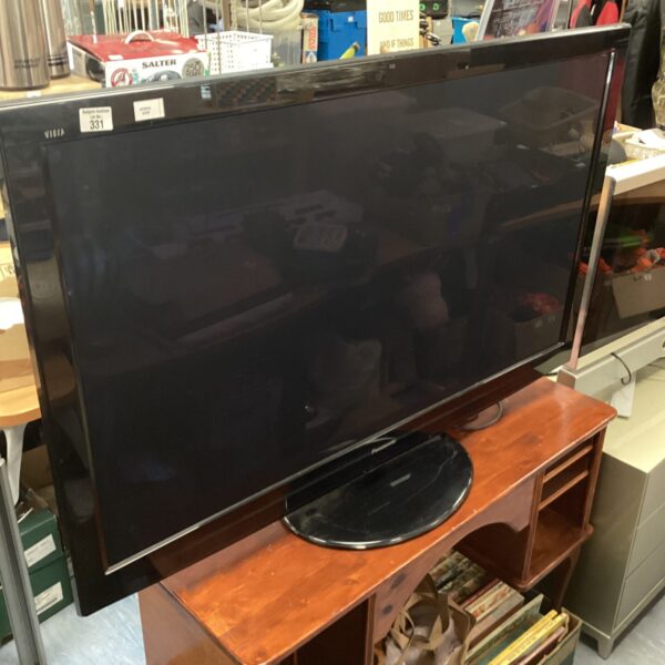 Black Panasonic Viera 50 inch television on a wooden table.