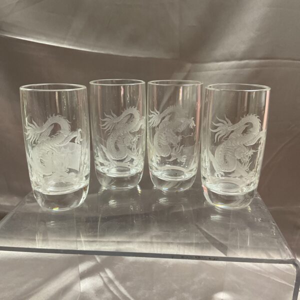 Close-up of hand-engraved dragon design on a shot glass.