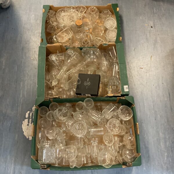 Assorted clear glassware in three boxes, vintage collection.