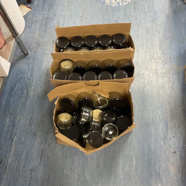 Job lot of reusable glass jars for kitchen storage.